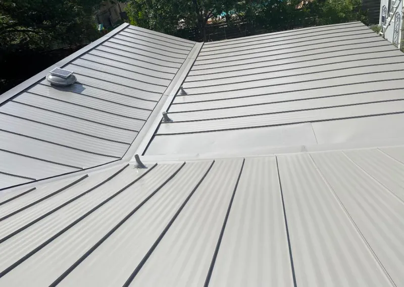 Solar attic fan installed on a metal roof for Roof Ventilation in Wauseon